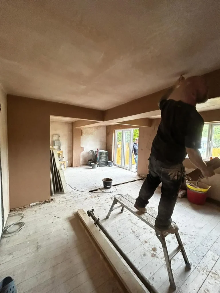 Plastering the ceiling of the newly opened-up kitchen and dining space