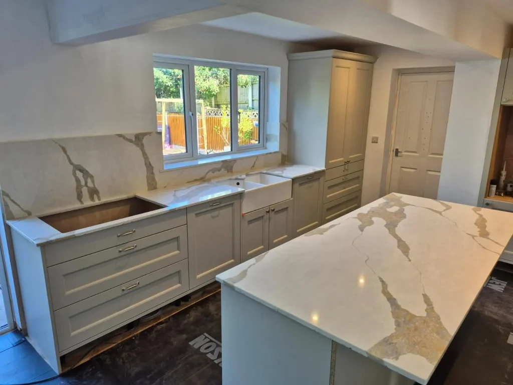 Sahara Waves quartz worktops and the Belfast sink fitted