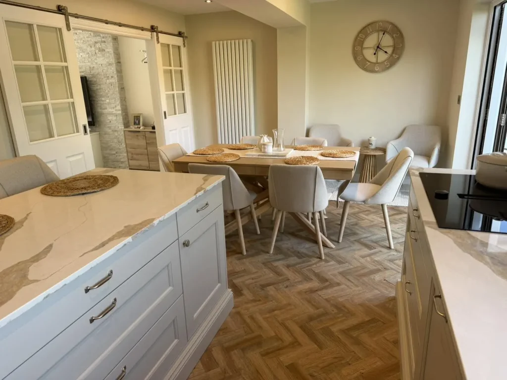 The dining area with the new tall anthracite radiator and kitchen island